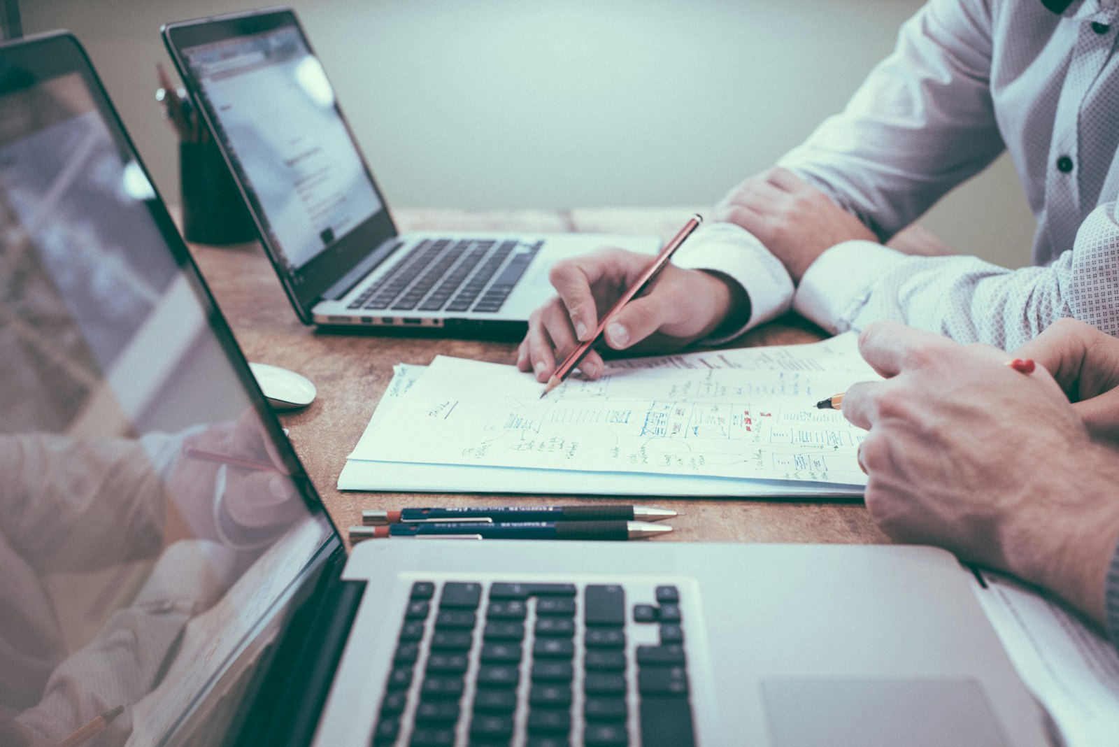 Professional reviewing financial documents at a desk